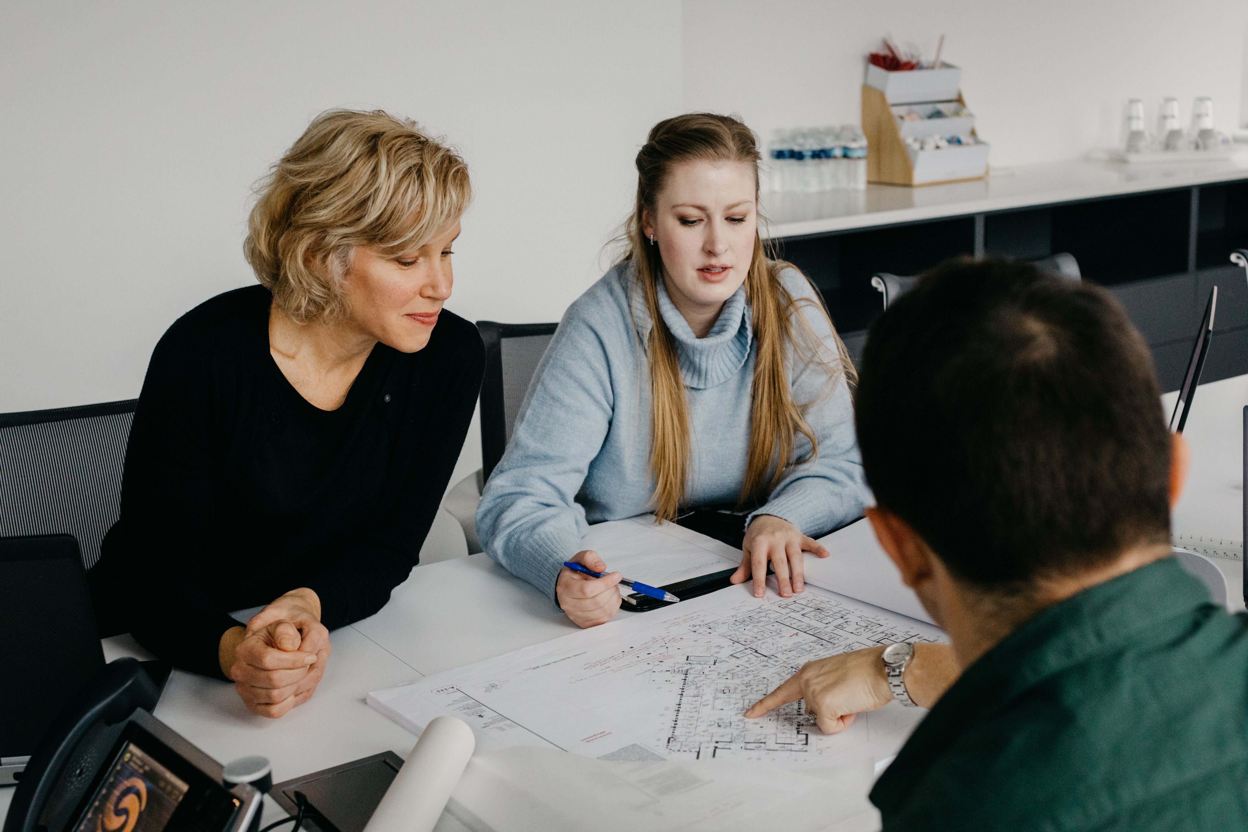 Angela Kolosky reviews floor plans with her team